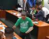 Man wearing a Hamas shirt distributes leaflets in a Chamber session on the crisis in Gaza
