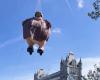 Aunt Marge, character from Harry Potter, is seen flying over London; see the video